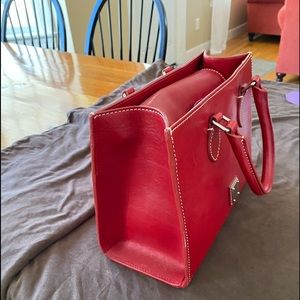 Dooney and bourke red purse 11x 8 like new few small pen marks inside